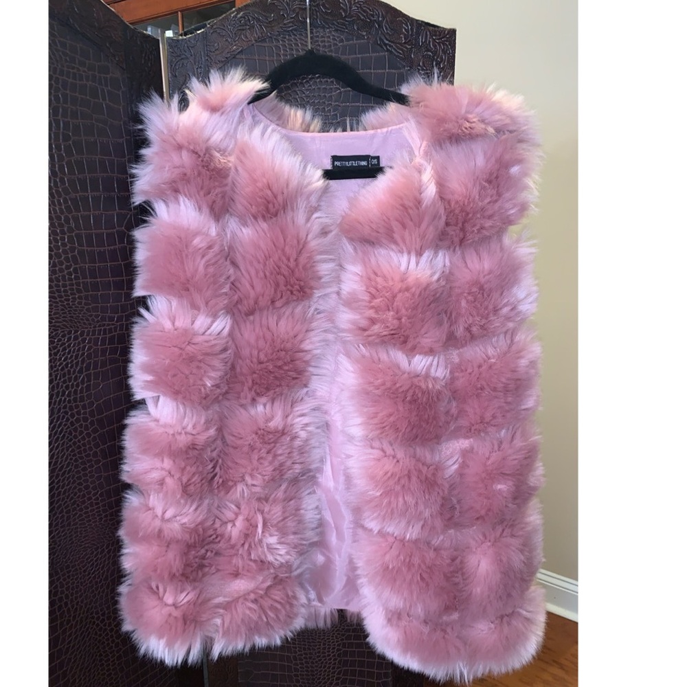 A faux fur pink vest